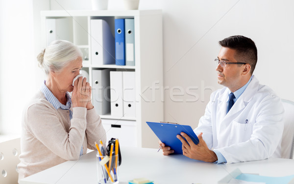 senior woman and doctor meeting at hospital Stock photo © dolgachov