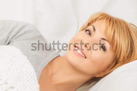 woman in bed Stock photo © dolgachov