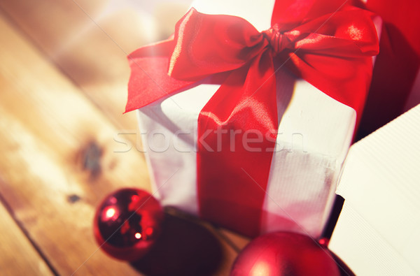 close up of gift boxes and red christmas balls Stock photo © dolgachov