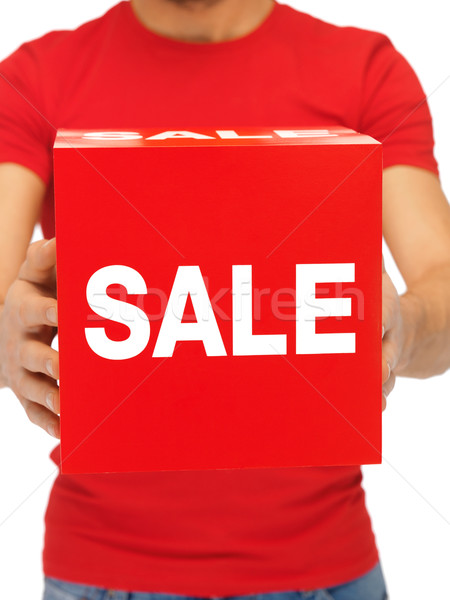 man holding sale sign Stock photo © dolgachov