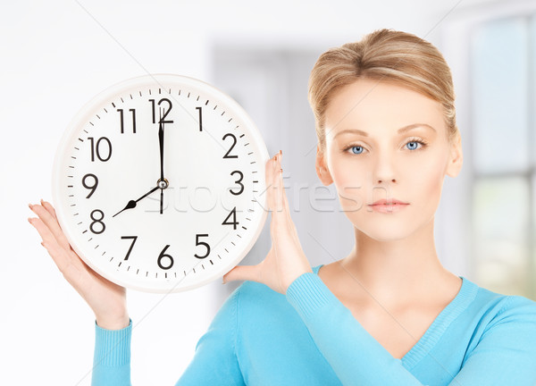 businesswoman with wall clock Stock photo © dolgachov