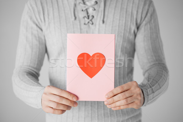 Człowiek pocztówkę kształt serca serca Zdjęcia stock © dolgachov