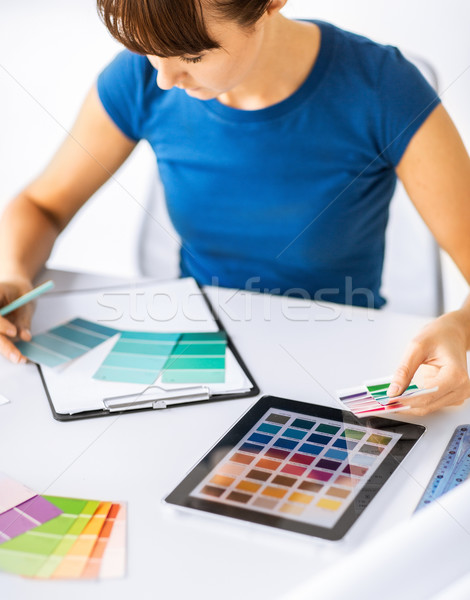 woman working with color samples for selection Stock photo © dolgachov