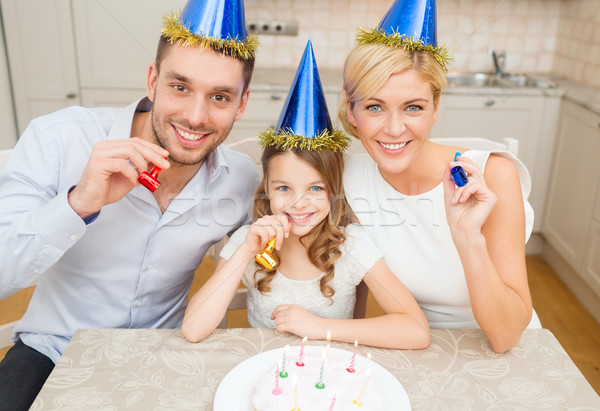 Lächelnd Familie blau Hüte begünstigen Stock foto © dolgachov