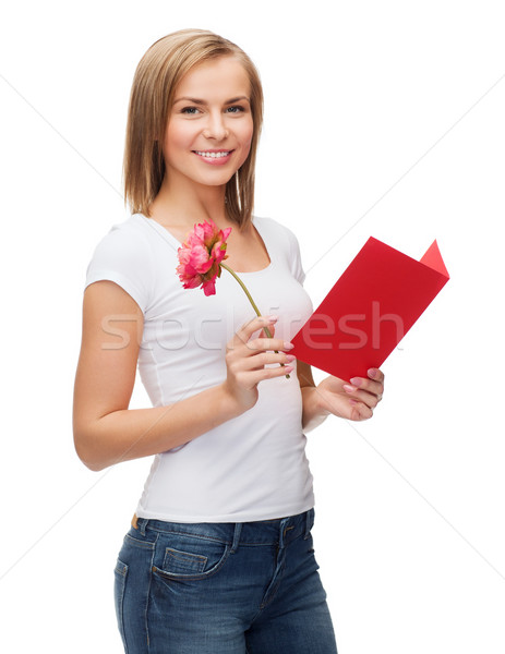 smiling girl with postcard and flower Stock photo © dolgachov