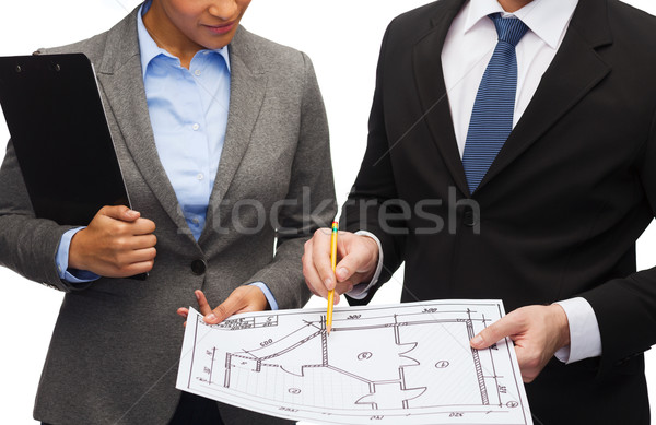 businesspeople with clipboard and blueprint Stock photo © dolgachov