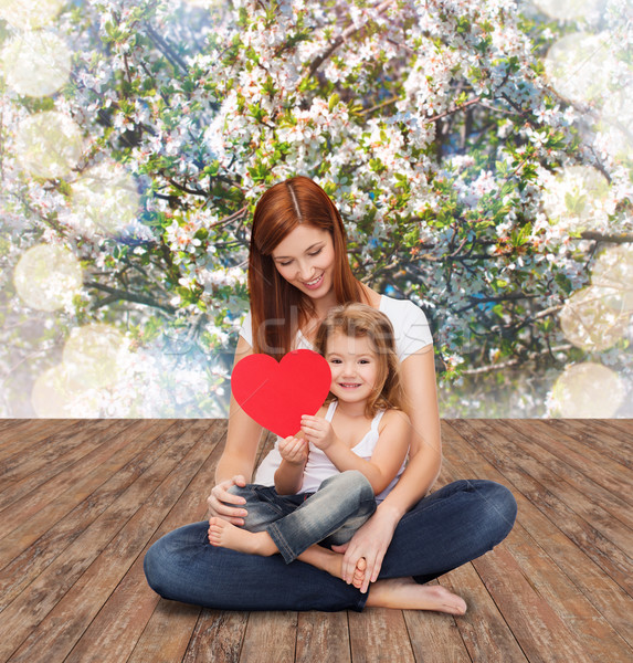 happy mother with adorable little girl and heart Stock photo © dolgachov