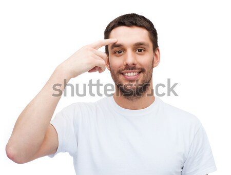 [[stock_photo]]: Souriant · jeunes · bel · homme · pointant · front · santé