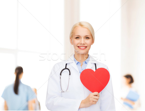 Sorridere femminile medico cuore stetoscopio sanitaria Foto d'archivio © dolgachov