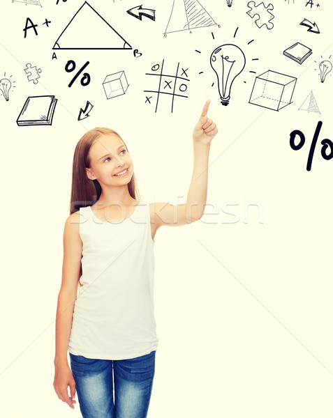 girl in white shirt pointing to idea Stock photo © dolgachov