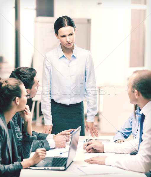 strict female boss talking to business team Stock photo © dolgachov
