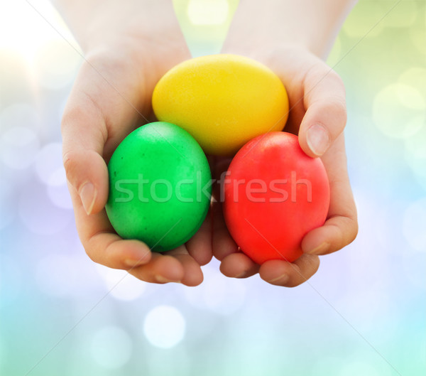 close up of kid hands holding colored eggs Stock photo © dolgachov