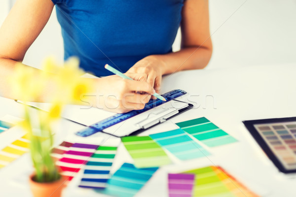 woman working with color samples for selection Stock photo © dolgachov