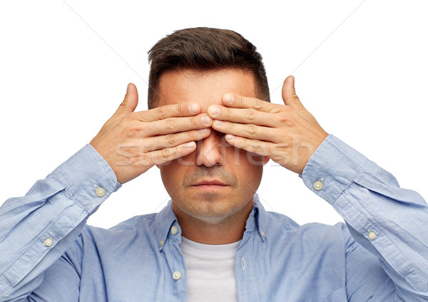 face of man covering his eyes with hands Stock photo © dolgachov