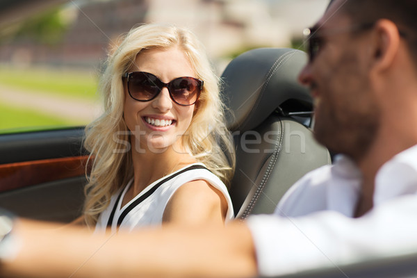 happy man and woman driving in cabriolet car Stock photo © dolgachov