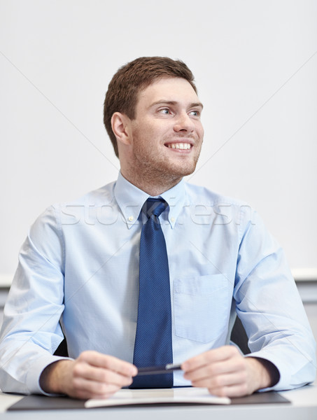 笑みを浮かべて ビジネスマン 座って オフィス ビジネスの方々  作業 ストックフォト © dolgachov