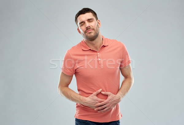 Nieszczęśliwy człowiek cierpienie ból brzucha ludzi opieki zdrowotnej Zdjęcia stock © dolgachov