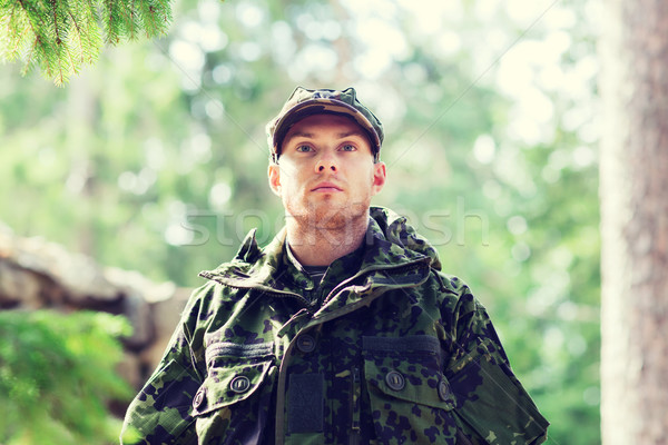 Stock photo: young soldier or ranger in forest
