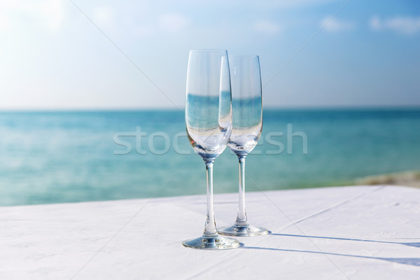  close up of two champagne glasses on beach  Stock photo © dolgachov