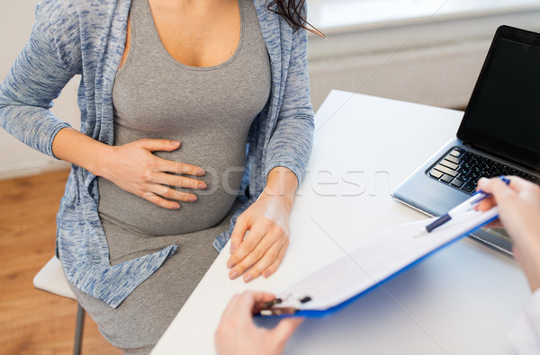 Stock photo: close up of doctor and pregnant woman at hospital