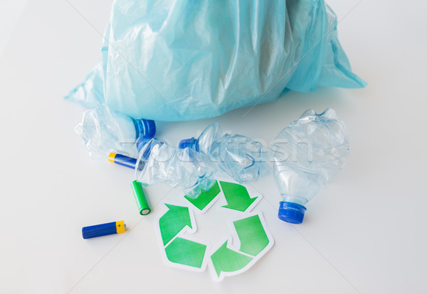 close up of used bottles and batteries recycling Stock photo © dolgachov