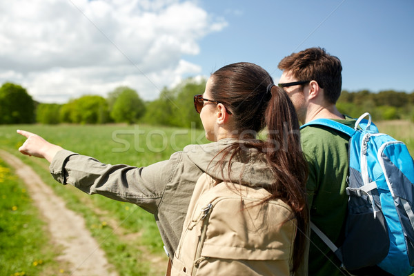 happy couple with backpacks hiking outdoors Stock photo © dolgachov