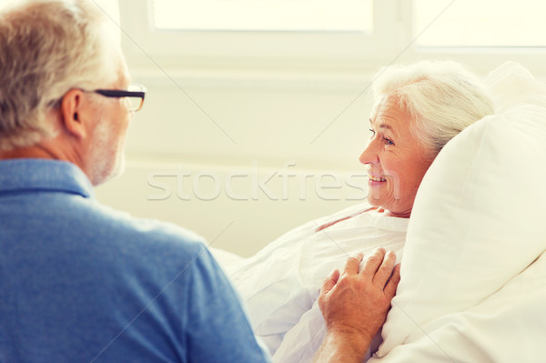 senior couple meeting at hospital ward Stock photo © dolgachov