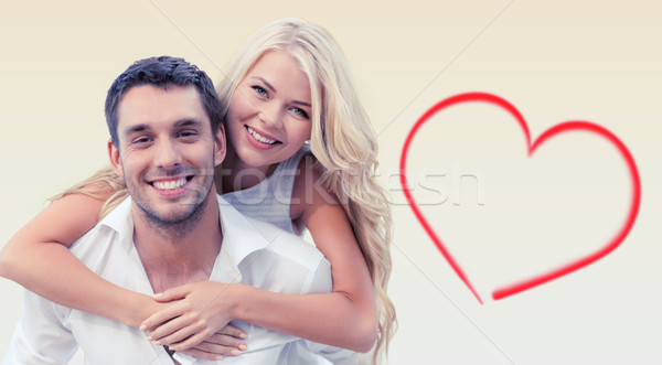 happy couple having fun over beige background Stock photo © dolgachov