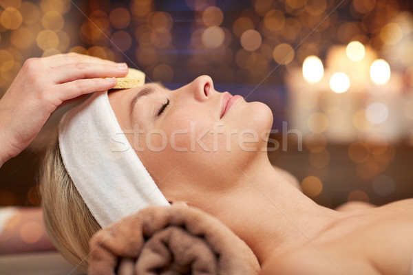 close up of woman having face cleaning in spa Stock photo © dolgachov