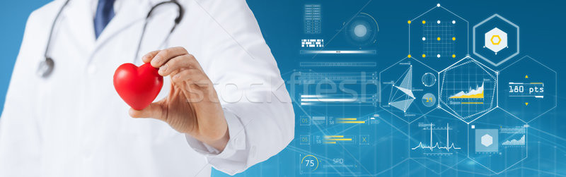 close up of doctor with red heart and charts Stock photo © dolgachov