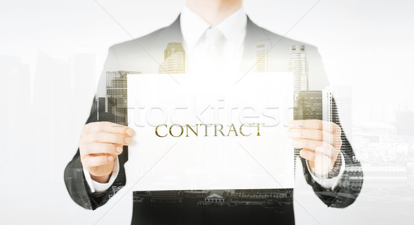 close up of businessman holding contract paper Stock photo © dolgachov