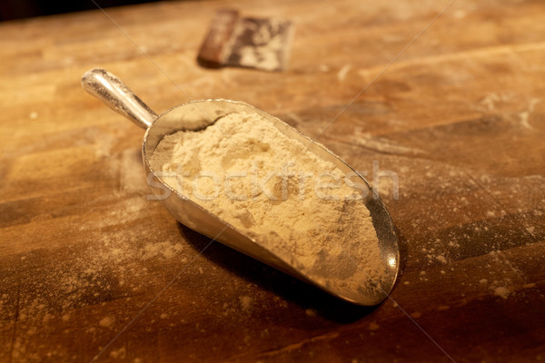 flour in bakery scoop and dough cutter on table Stock photo © dolgachov