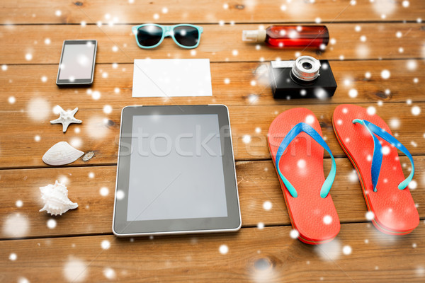 tablet pc and beach stuff Stock photo © dolgachov