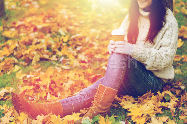 close up of woman drinking coffee in autumn park Stock photo © dolgachov