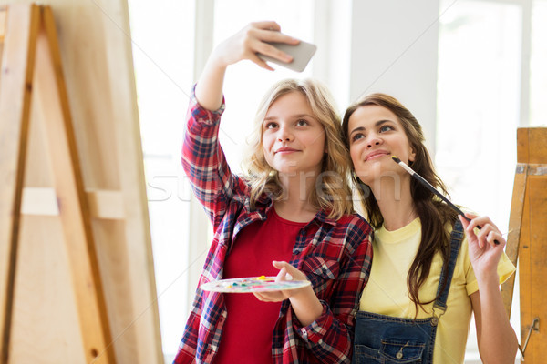 artist girls taking selfie at art studio or school Stock photo © dolgachov