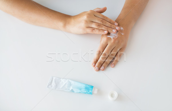 close up of hands with cream or therapeutic salve Stock photo © dolgachov
