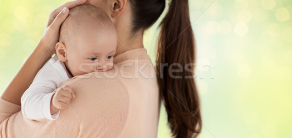 close up of little baby boy with mother Stock photo © dolgachov