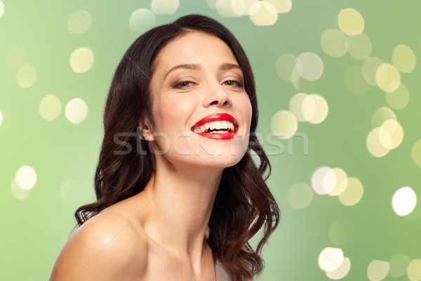 Güzel gülen genç kadın kırmızı ruj güzellik makyaj Stok fotoğraf © dolgachov