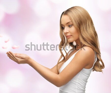 Stock photo: woman holding something on the palms