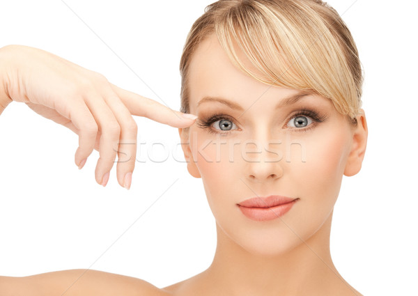 beautiful woman touching her eye area Stock photo © dolgachov
