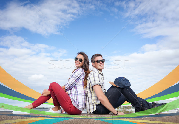 teenagers sitting back to back Stock photo © dolgachov