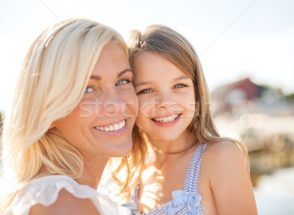 happy mother and child girl Stock photo © dolgachov