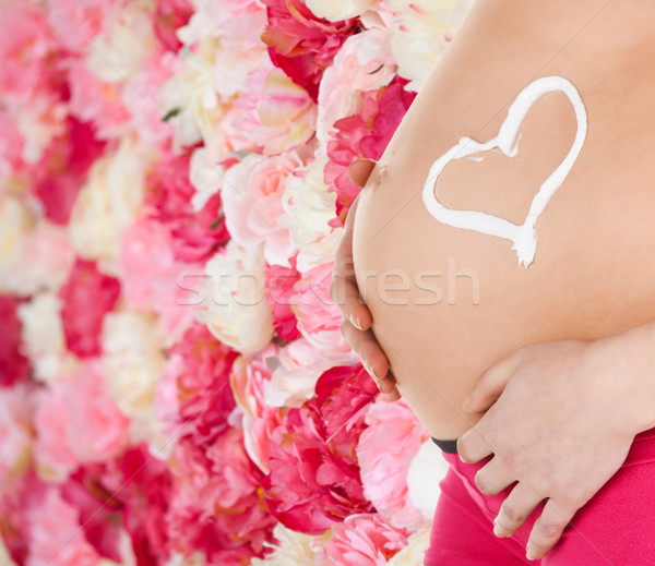 belly of a pregnant woman Stock photo © dolgachov