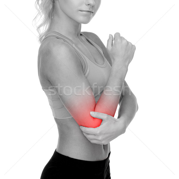 sporty woman with pain in elbow Stock photo © dolgachov