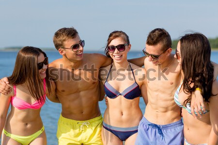 group of smiling young women in sunglasses Stock photo © dolgachov