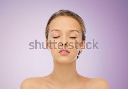 close up of beautiful young woman looking down Stock photo © dolgachov