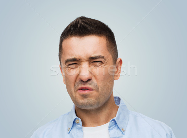 Férfi kellemetlen szag érzelmek arckifejezés emberek szürke Stock fotó © dolgachov