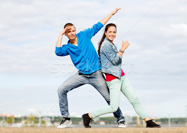 couple of teenagers dancing outside Stock photo © dolgachov
