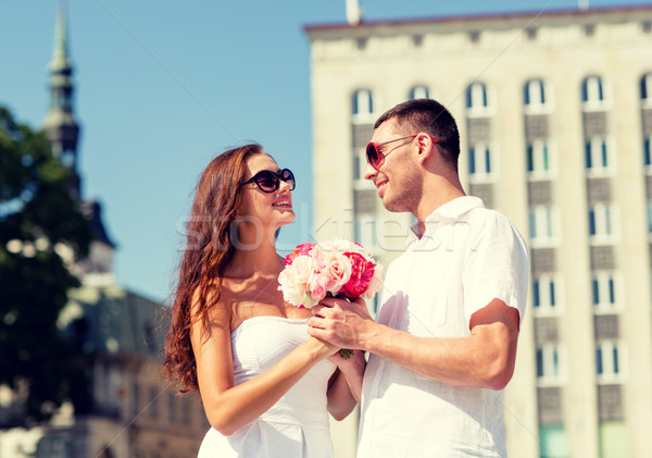 Stock photo: smiling couple in city