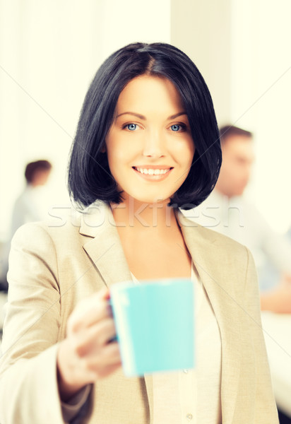 beautiful businesswoman with cup of coffee Stock photo © dolgachov